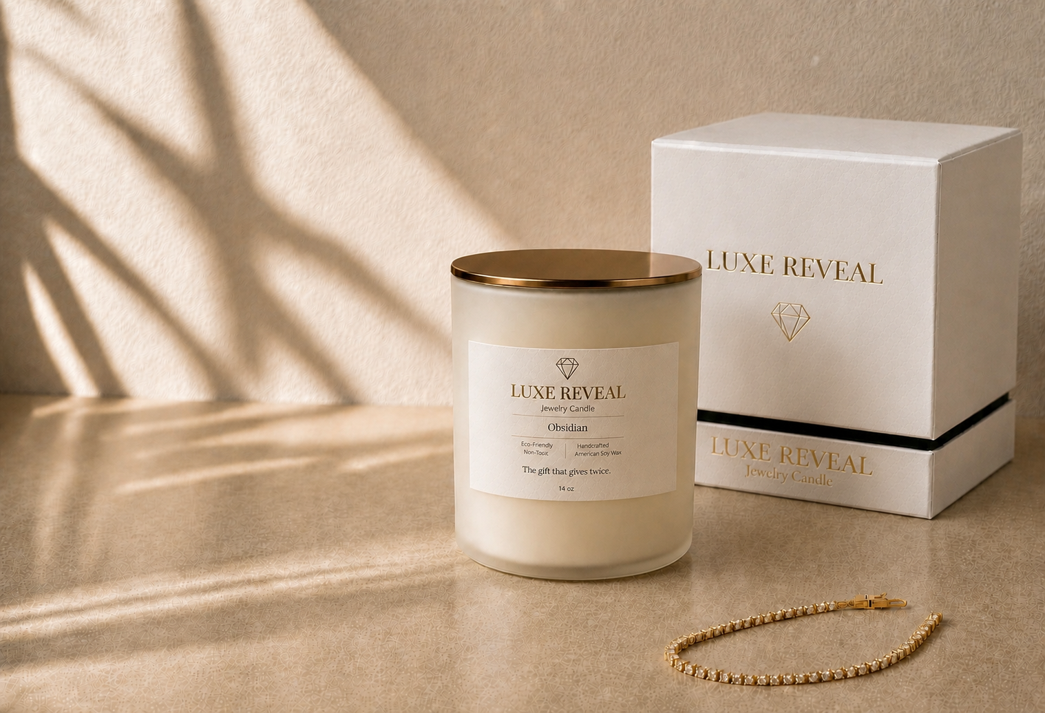Luxe Reveal Obsidian candle with luxury gift box and a gold tennis bracelet